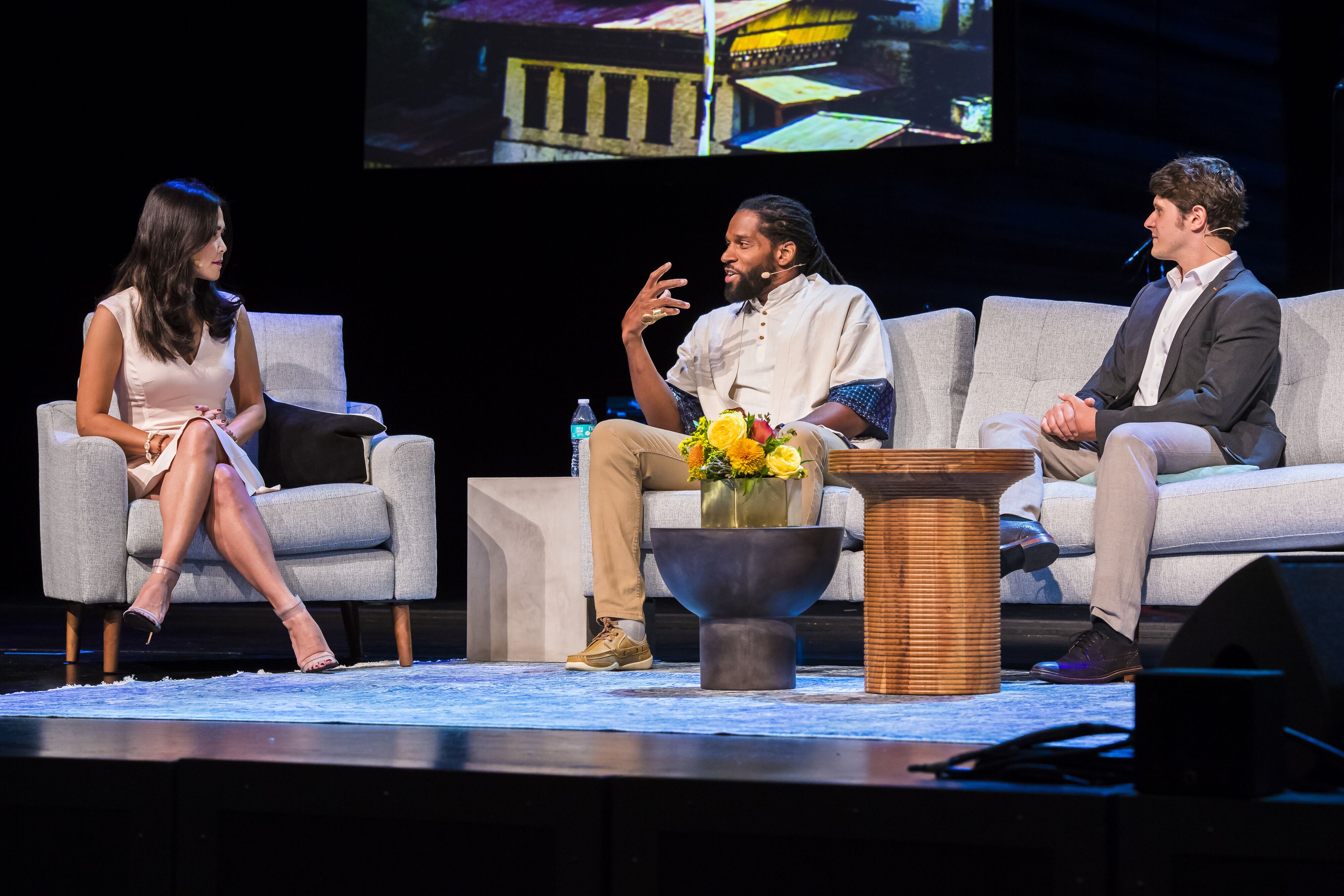Marques Anderson speaking with fellow panelists at TWIN Global.