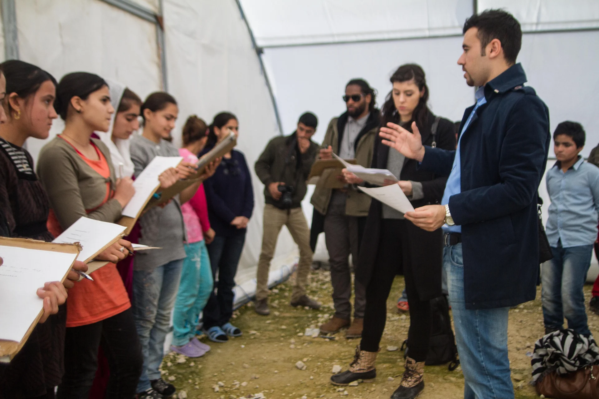 Young participants and a facilitator share ideas during a World Education Foundation workshop in Iraq.